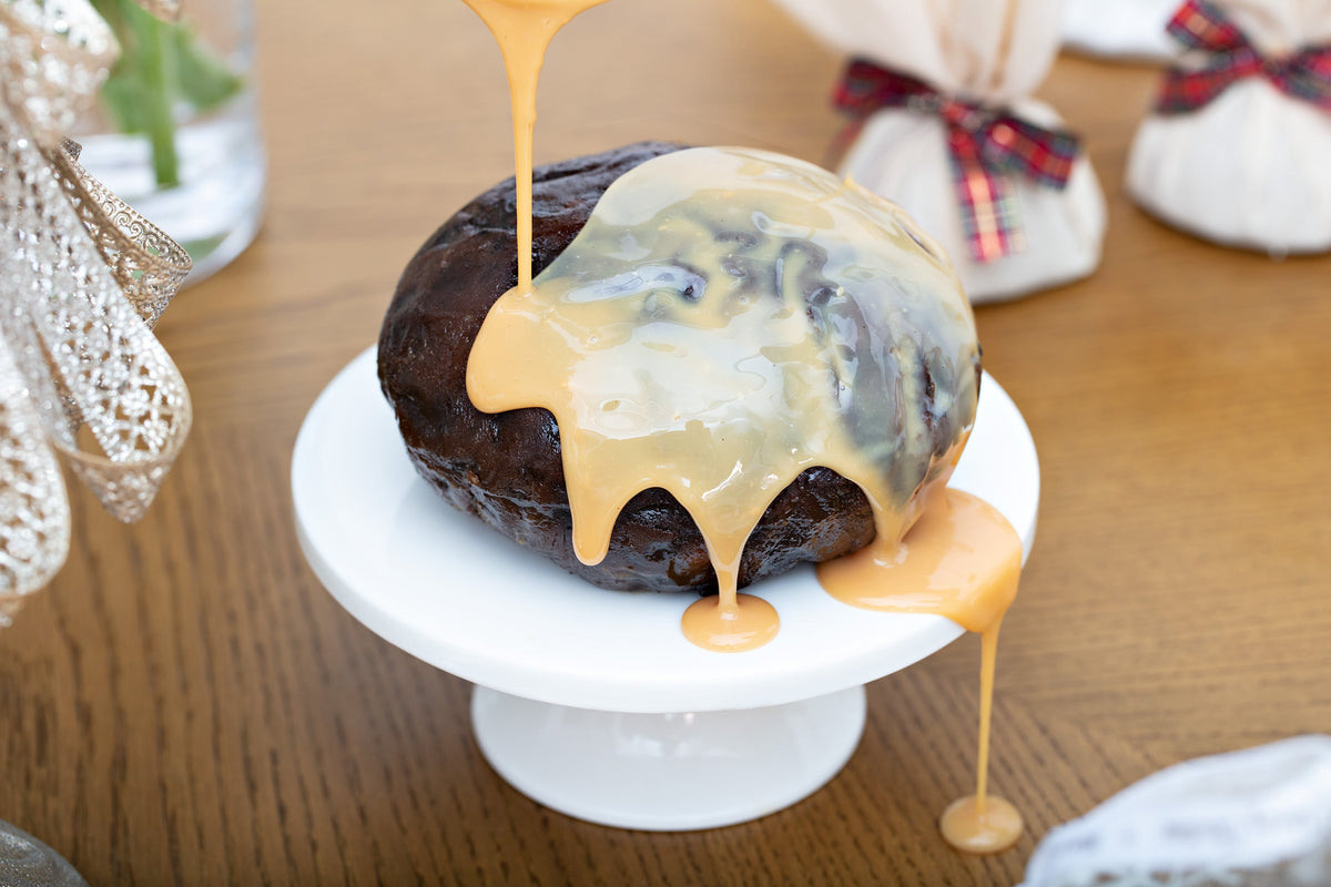 Brandy custard poured over a Christmas pudding